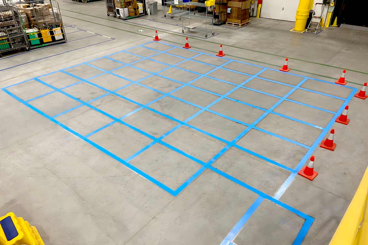 Warehouse floor markings by 1-800-STRIPER